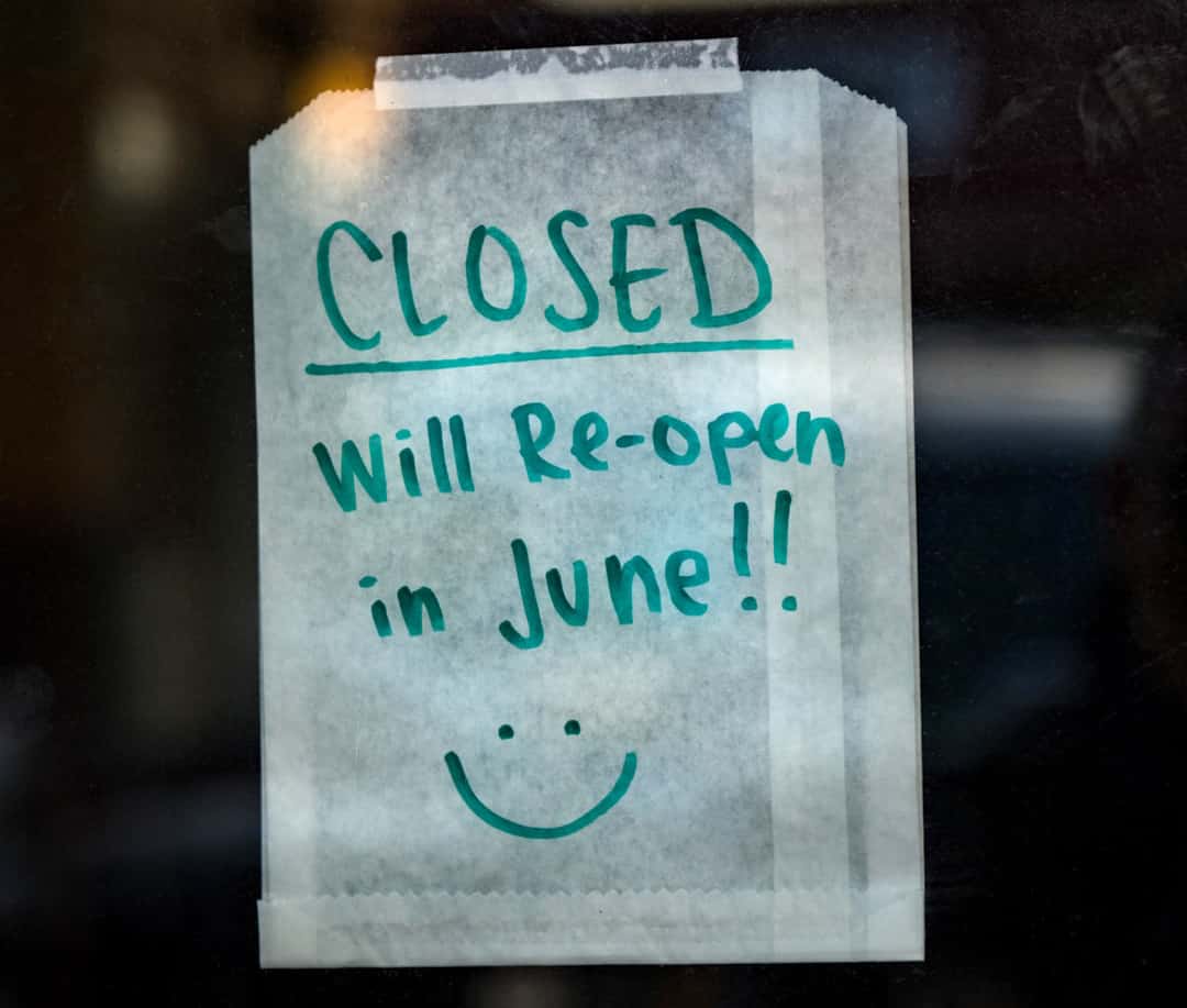 sign on window saying closed until June