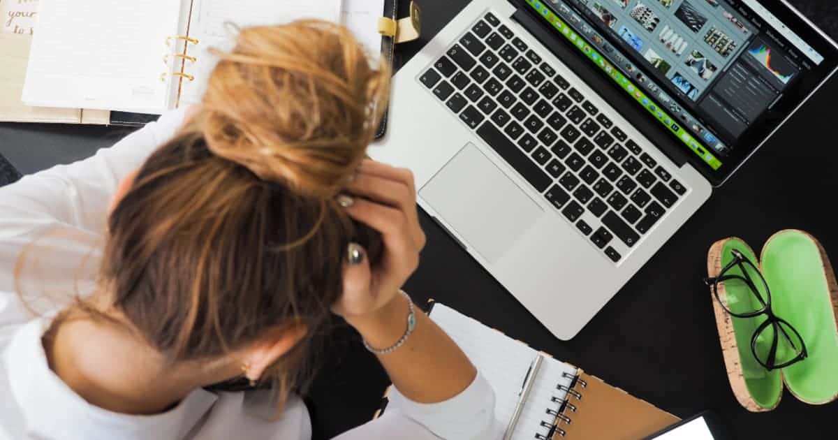 frustrated woman looking at laptop computer